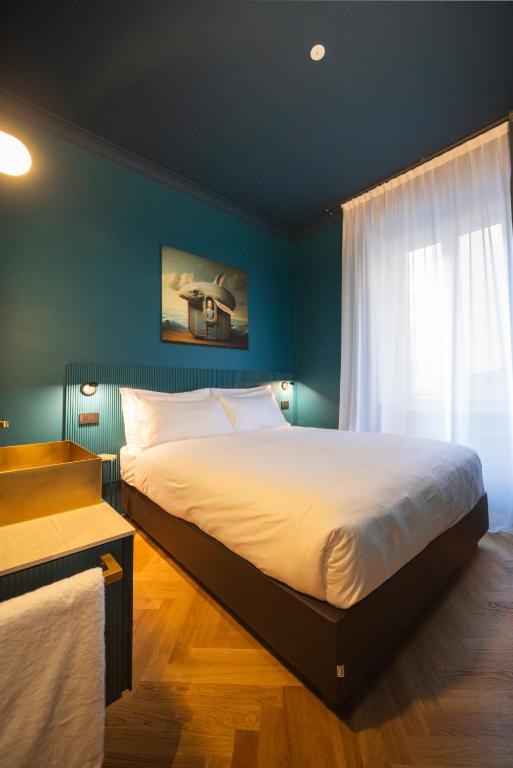 Postel nebo postele na pokoji v ubytování Fontana 16 Rooms