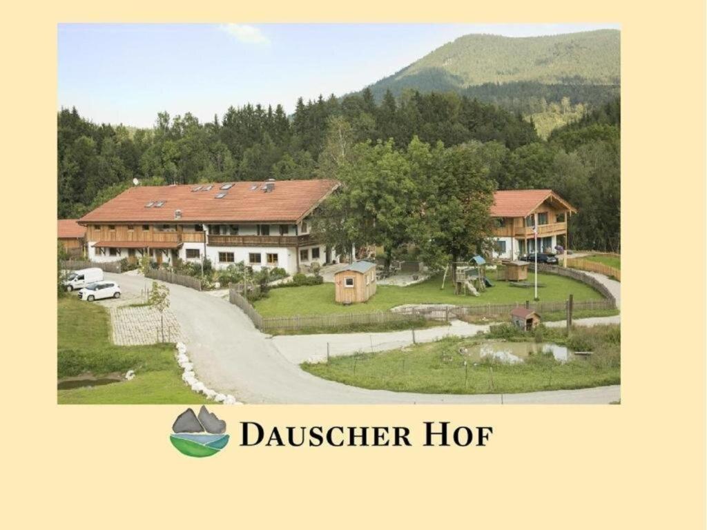 ein großes Haus mit einer Einfahrt davor in der Unterkunft Dauscher Hof Wellness & Relaxen in Inzell