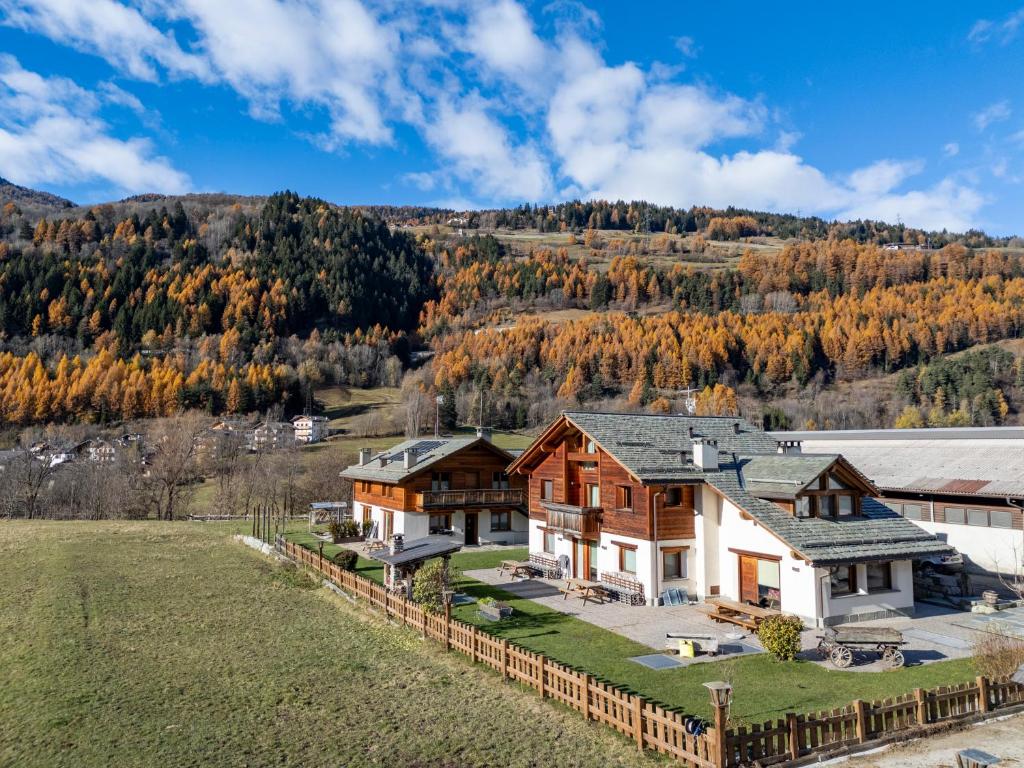 an aerial view of a house with a hill in the background at Agriturismo La Stalla in Bormio