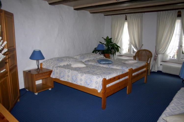 Postel nebo postele na pokoji v ubytování Hotel zum alten Schweizer