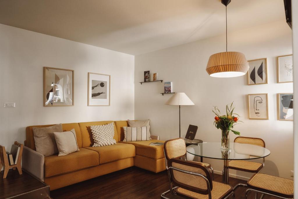 a living room with a couch and a table at YourSuiteRome in Rome
