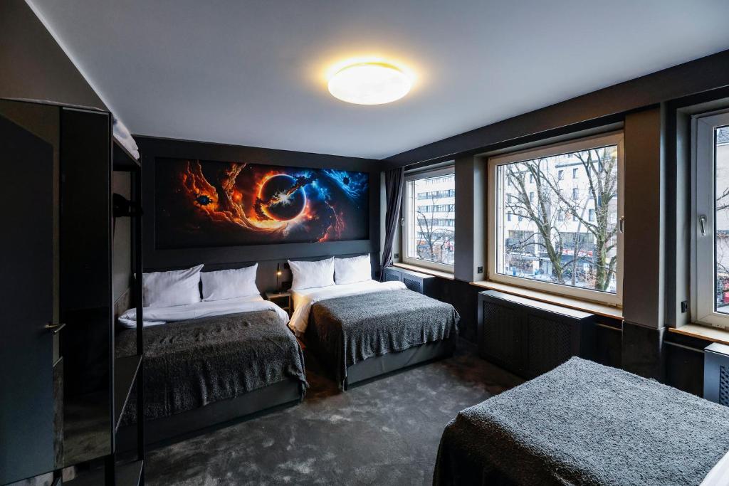 Postel nebo postele na pokoji v ubytování Sleephotels Cosmos