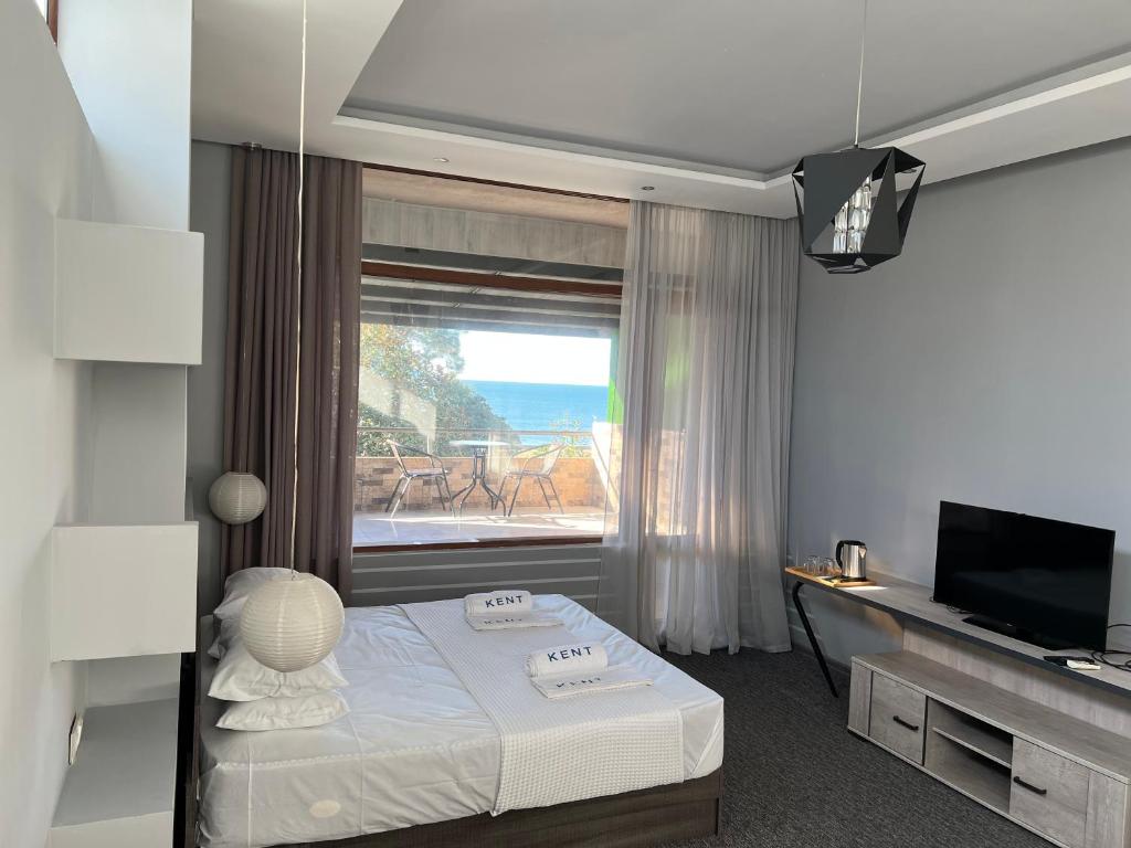 Postel nebo postele na pokoji v ubytování KENT hotel & Restaurant KENT beach