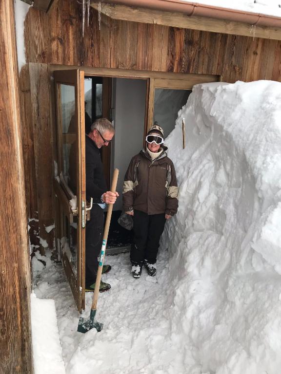 a couple of people standing in a snow cave at Hillary Hotel in Les Menuires