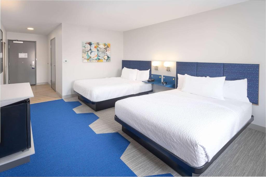 Postel nebo postele na pokoji v ubytování Microtel Inn & Suites by Wyndham Macedon