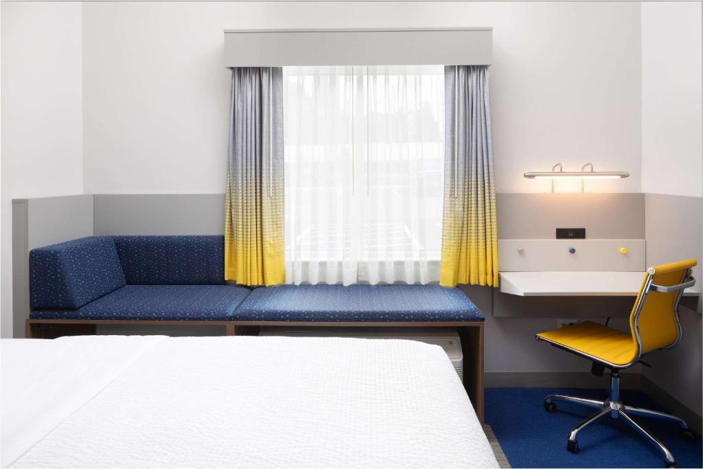 Postel nebo postele na pokoji v ubytování Microtel Inn & Suites by Wyndham Macedon