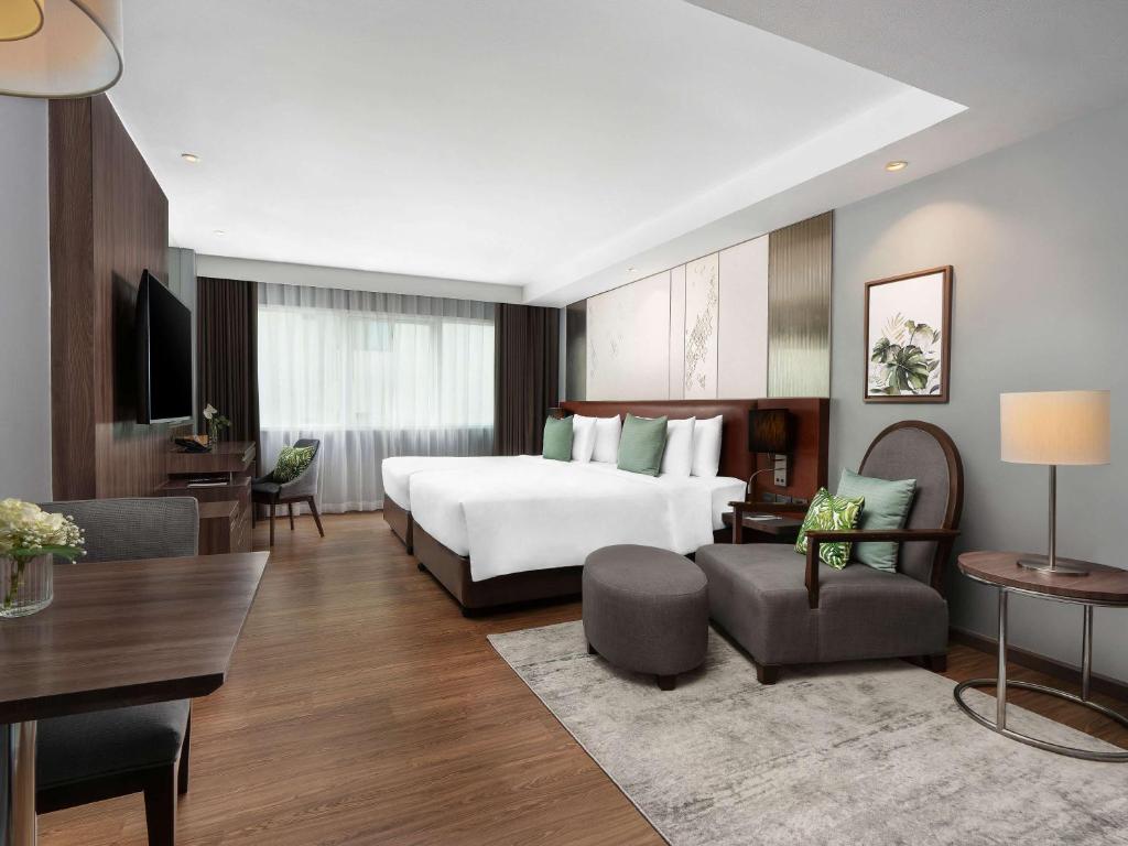 Postel nebo postele na pokoji v ubytování Novotel Living Bangkok Sukhumvit Legacy