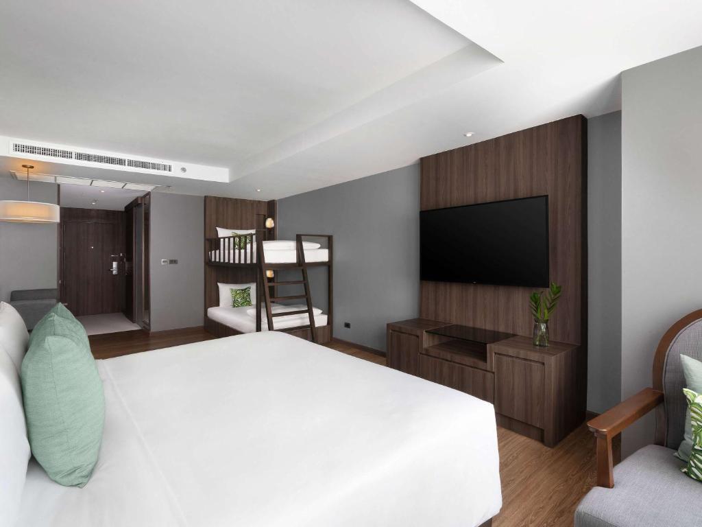 Postel nebo postele na pokoji v ubytování Novotel Living Bangkok Sukhumvit Legacy