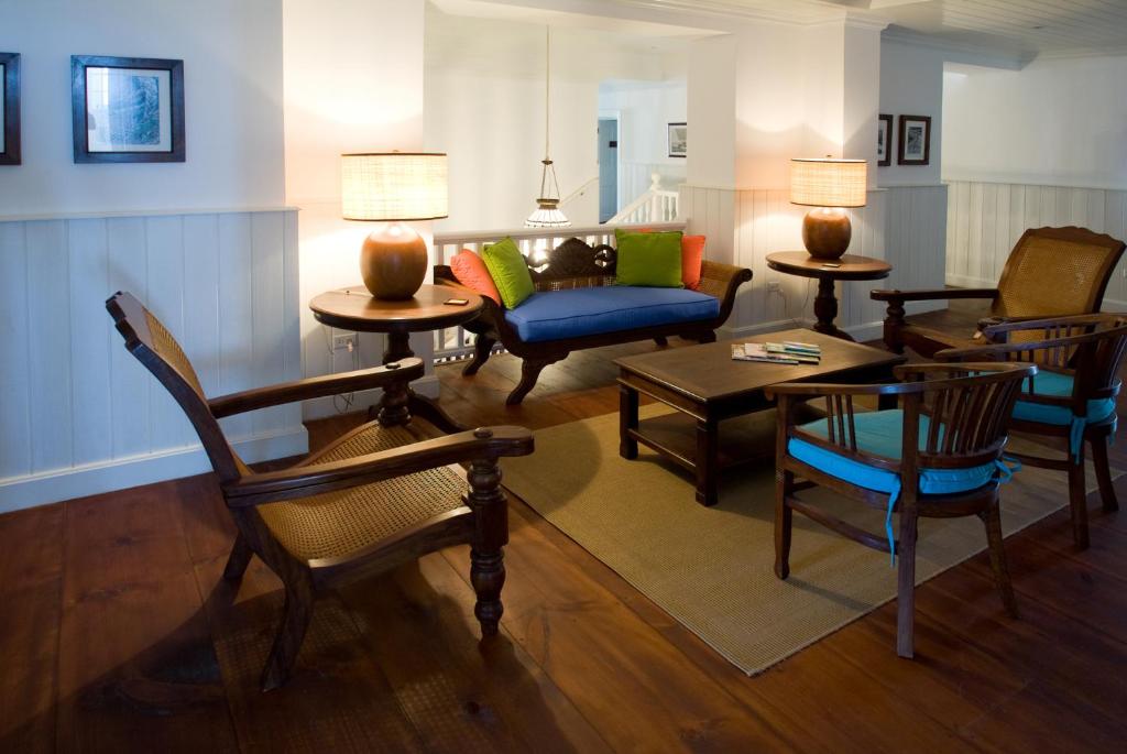 a living room with chairs and a couch at The Atlantis Historic Inn in Saint Joseph