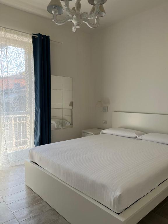 Postel nebo postele na pokoji v ubytování FLORA