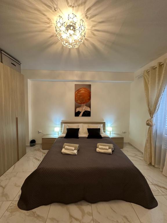 Posteľ alebo postele v izbe v ubytovaní Diana'S Exclusive Apartment