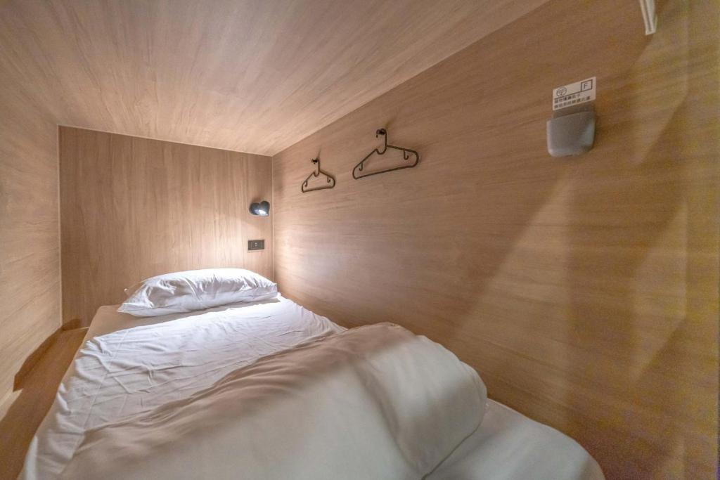 Postel nebo postele na pokoji v ubytování Times Inn - Tainan
