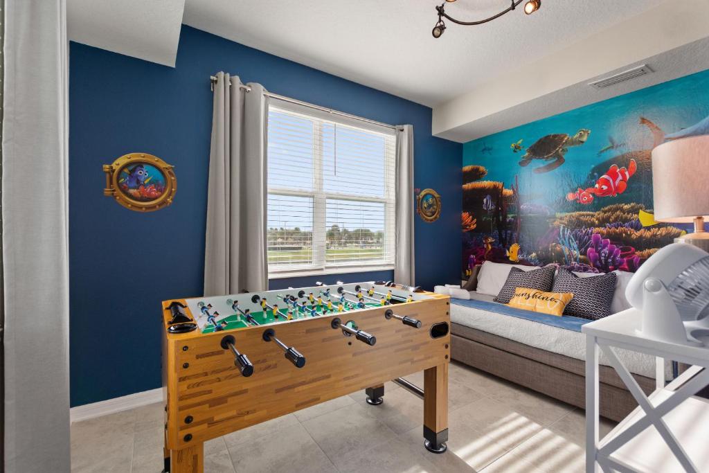 a childs room with a bed and a pool table at Serenity Haven - Storey Lake #701 by Shine Villas in Kissimmee