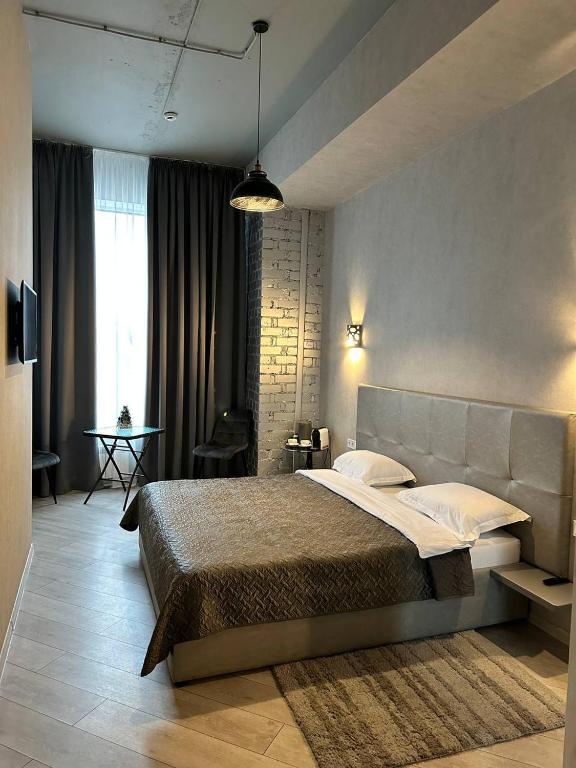 Postel nebo postele na pokoji v ubytování Hotel Nika 2