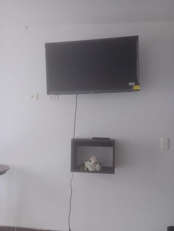TV a/nebo společenská místnost v ubytování casa 4 cocorna