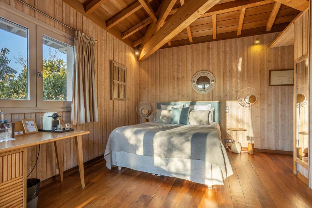 Postel nebo postele na pokoji v ubytování Hôtel Côté Sable