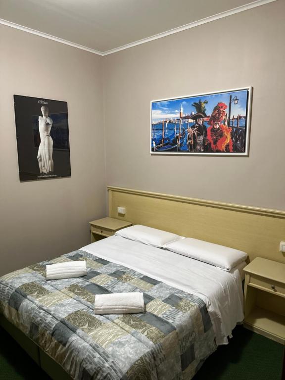 Postel nebo postele na pokoji v ubytování Nuova Locanda Belvedere
