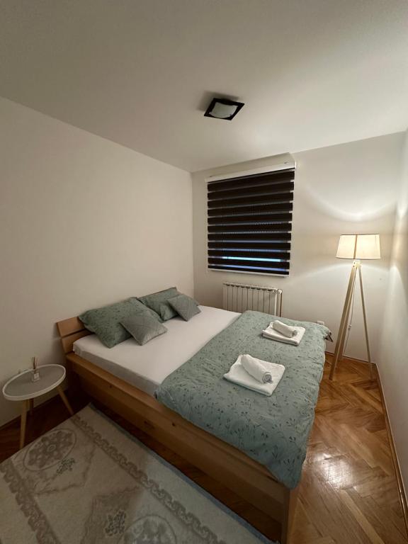 מיטה או מיטות בחדר ב-Čarolija
