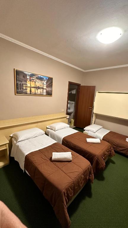 Postel nebo postele na pokoji v ubytování Nuova Locanda Belvedere