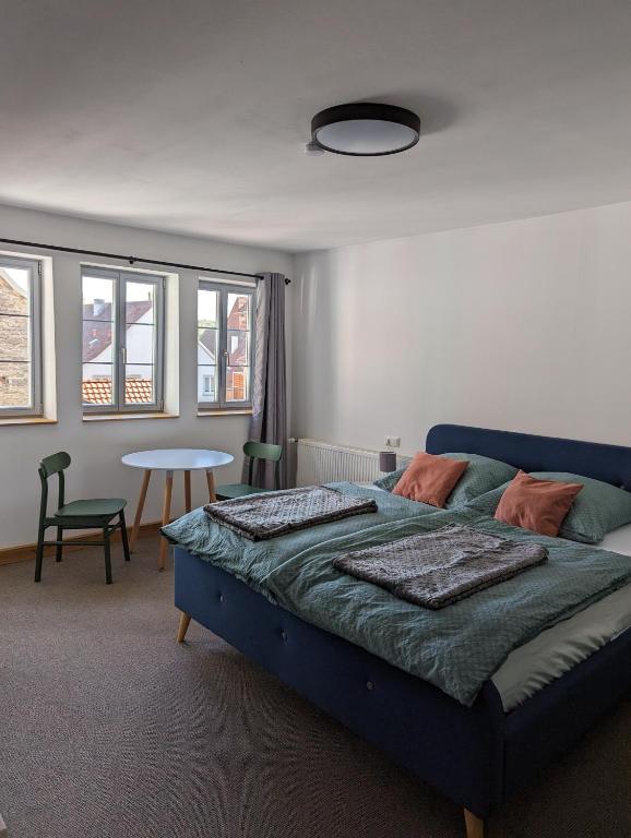 Postel nebo postele na pokoji v ubytování Gästezimmer Michelskeller