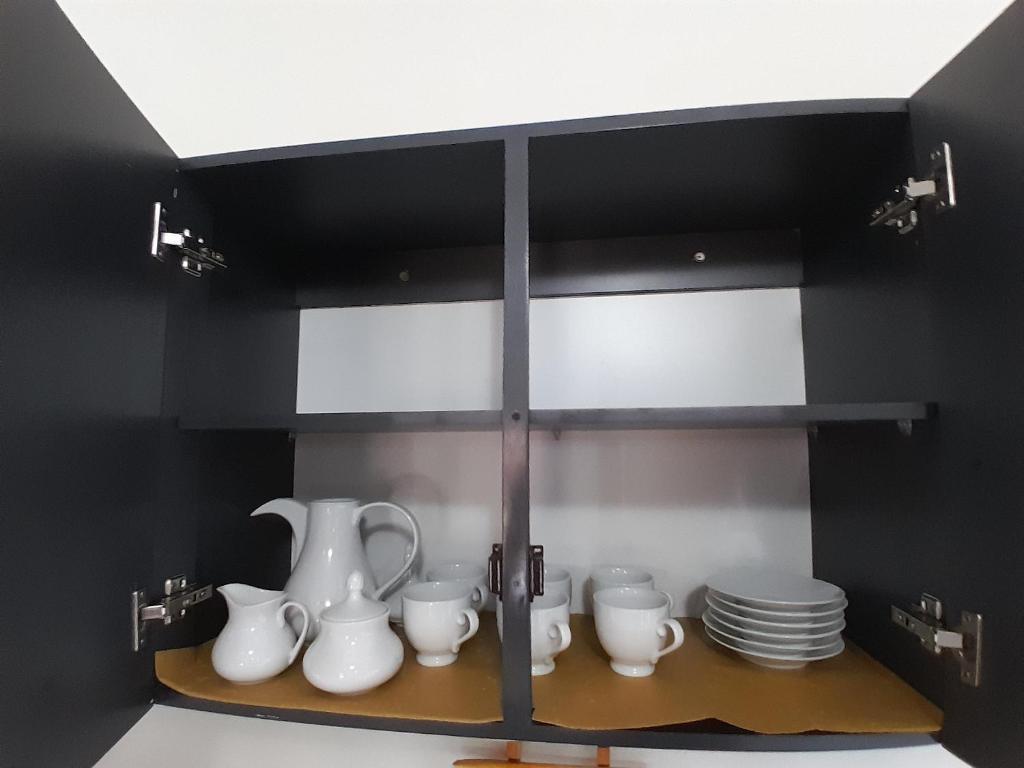 Příslušenství pro přípravu čaje a kávy v ubytování Ralph recedency