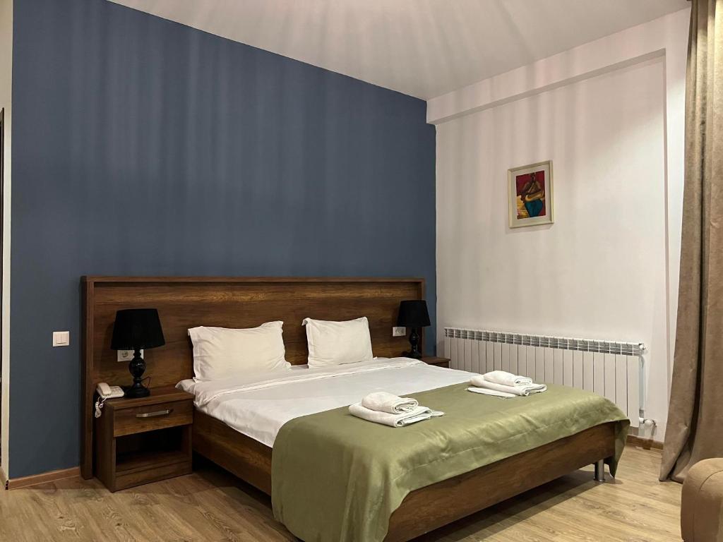 Postel nebo postele na pokoji v ubytování Hotel King Tom