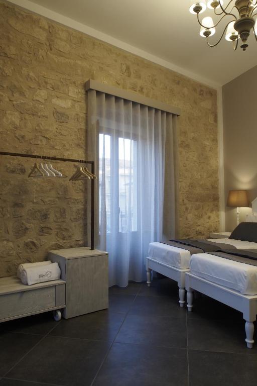 Postel nebo postele na pokoji v ubytování Terrazzani Suite