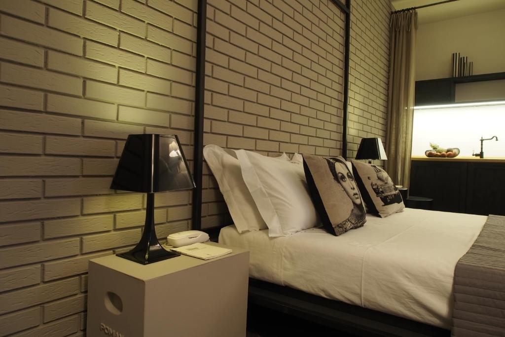 Postel nebo postele na pokoji v ubytování Terrazzani Suite