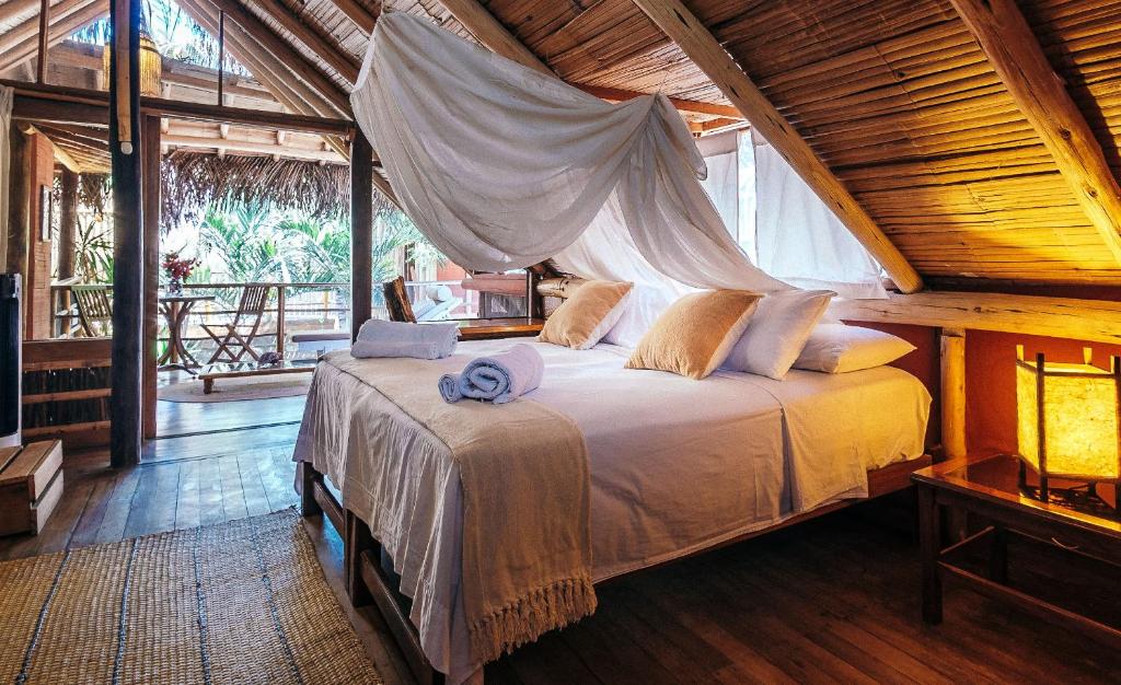 Postel nebo postele na pokoji v ubytování La Maison Eco House & Yoga