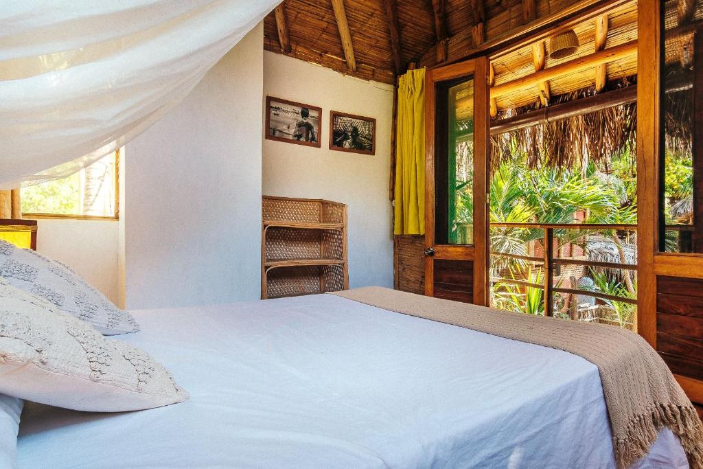 Postel nebo postele na pokoji v ubytování La Maison Eco House & Yoga