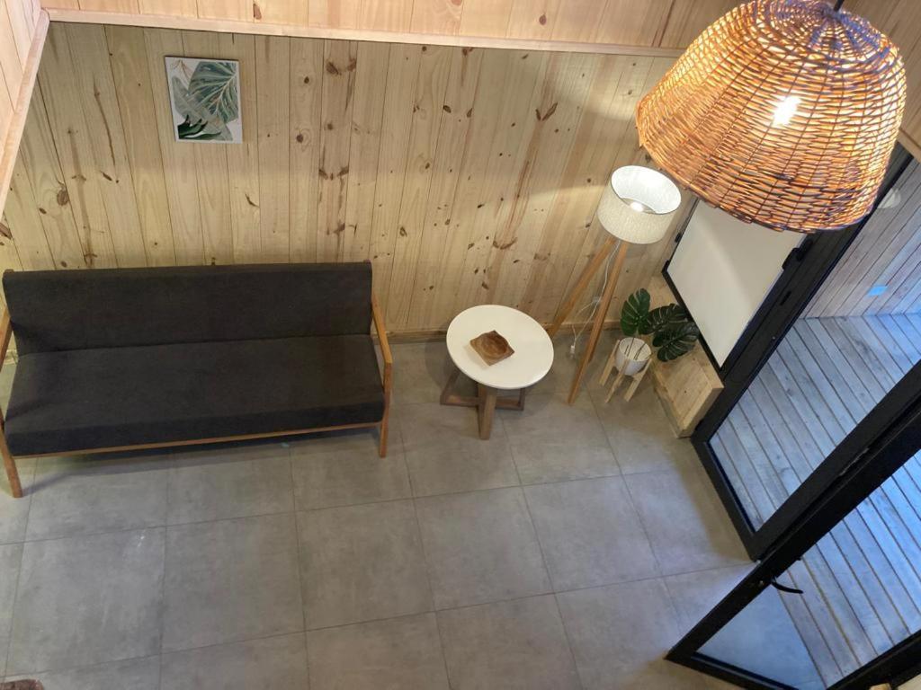 an overhead view of a living room with a couch at Galpon de Burgos - SalePatagonia in San Martín de los Andes