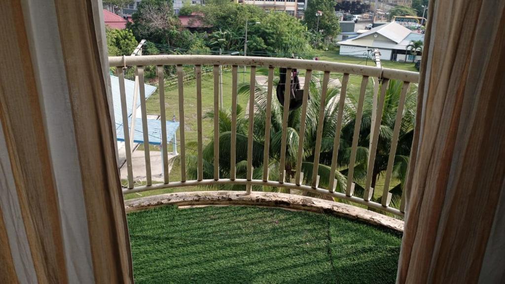 a balcony with a view of a yard at Moona Sweet Home 1 in Batu Caves