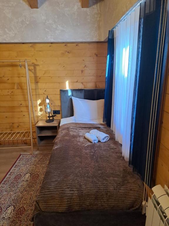 Postel nebo postele na pokoji v ubytování Rooms and apartmants Mirovic