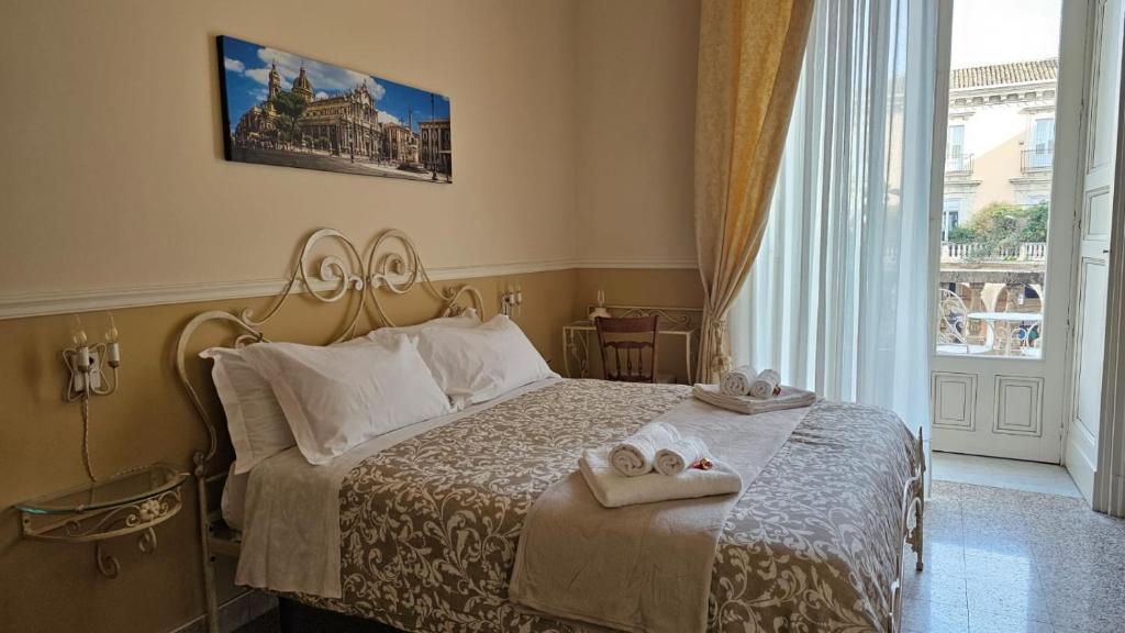 Postel nebo postele na pokoji v ubytování Bellini Inn Deluxe