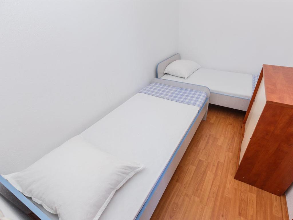 Postel nebo postele na pokoji v ubytování Apartments Stef