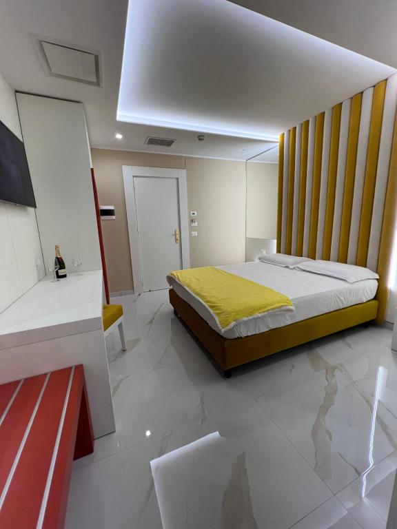 Postel nebo postele na pokoji v ubytování Hotel Smeraldo