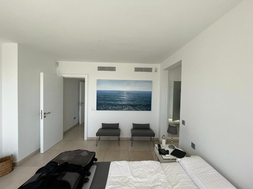 A bed or beds in a room at Villa del Mar Lanzarote - Luxury Beachhouse
