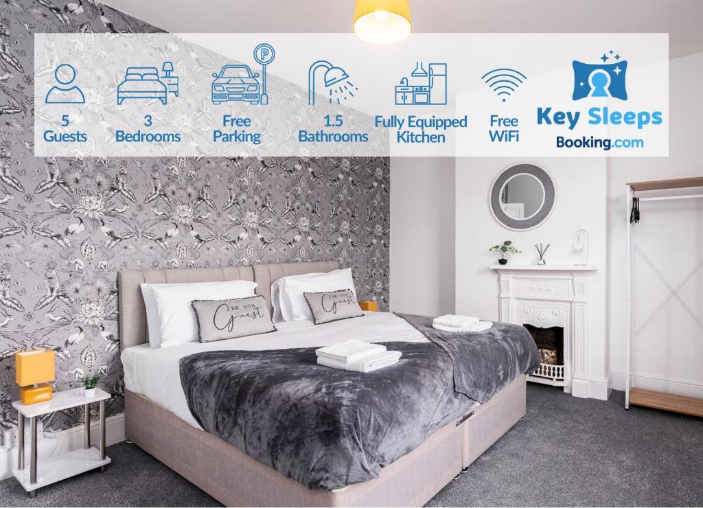 a bedroom with a bed and a wall with signs at Stunning Three Bedroom House At Keysleeps Short Lets Cleethorpes With Free Parking & Beach Location in Cleethorpes