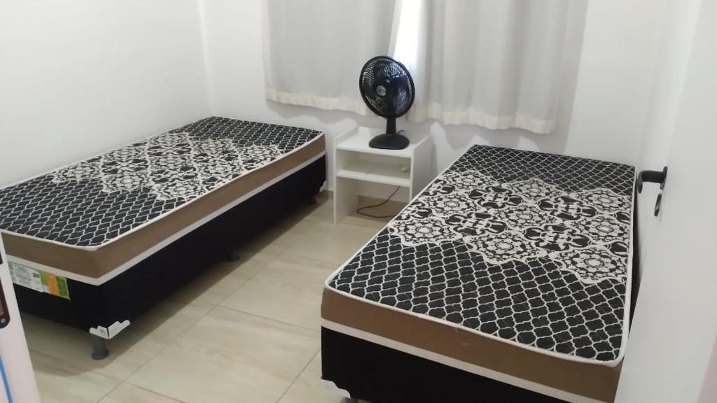Katil atau katil-katil dalam bilik di Village no Residencial Ecoville das Mangueiras, 3km da praia de Guarajuba