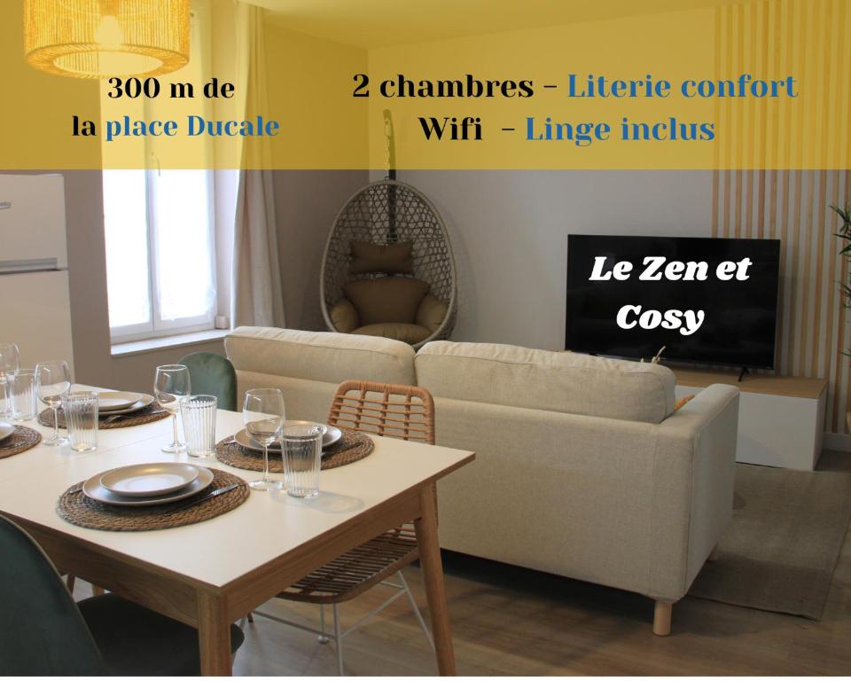 ein Wohnzimmer mit einem Tisch und einem Sofa in der Unterkunft Le Zen & Cosy*Hyper centre in Charleville-Mézières