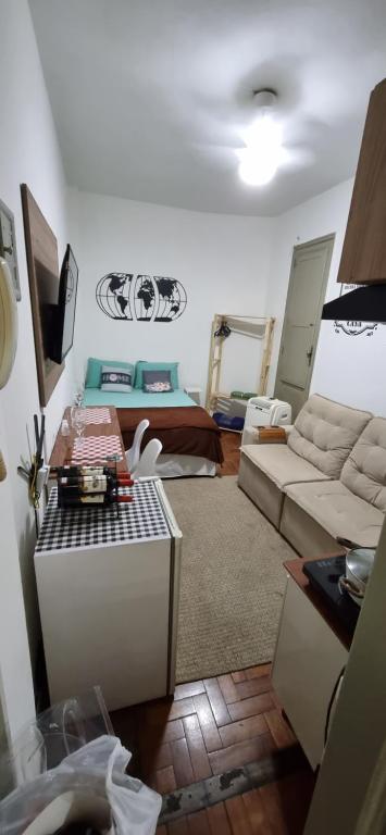 a living room with a couch and a table at Sambódromo Lapa Santa Teresa Centro in Rio de Janeiro