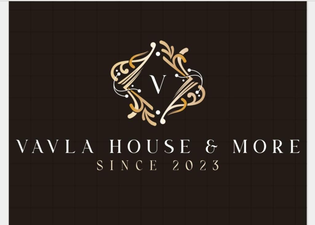 a logo for a luxury hotel with a letter v at Vavla House in Berat