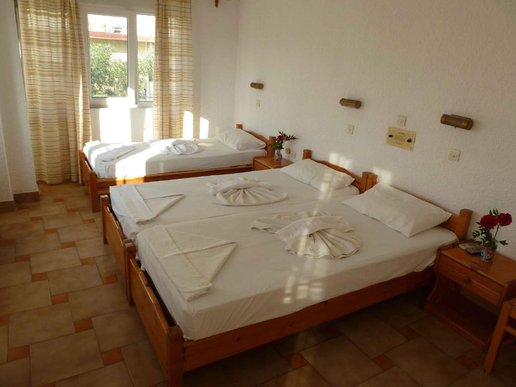 Postel nebo postele na pokoji v ubytování Paris Beach Hotel