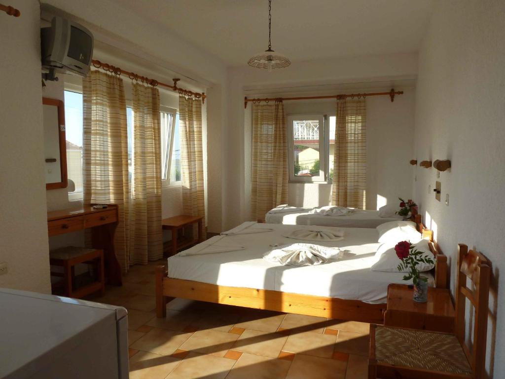 Postel nebo postele na pokoji v ubytování Paris Beach Hotel