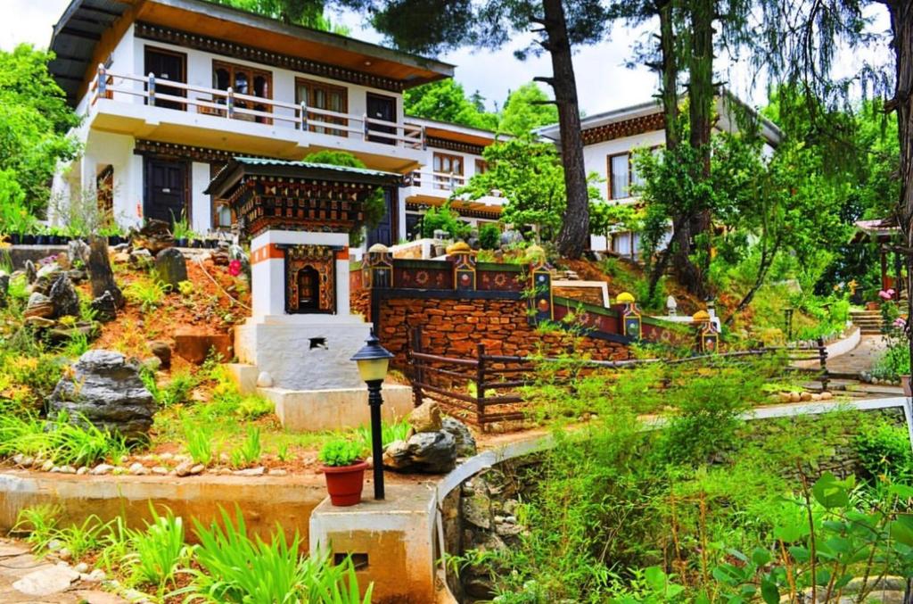 a house with a garden in front of it at Himalayan Star Resort in Paro