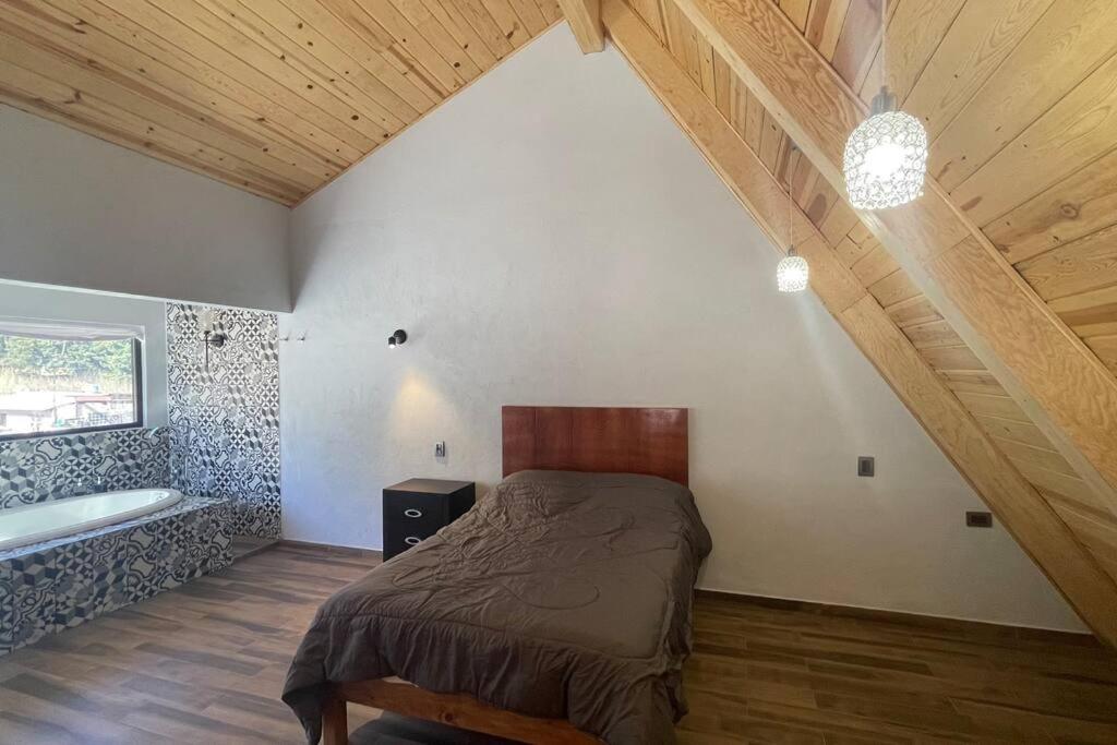 Llit o llits en una habitació de Cabaña Alpina