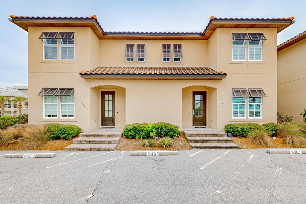 a house with a parking lot in front of it at Miramar Beach Villas #946B in Destin