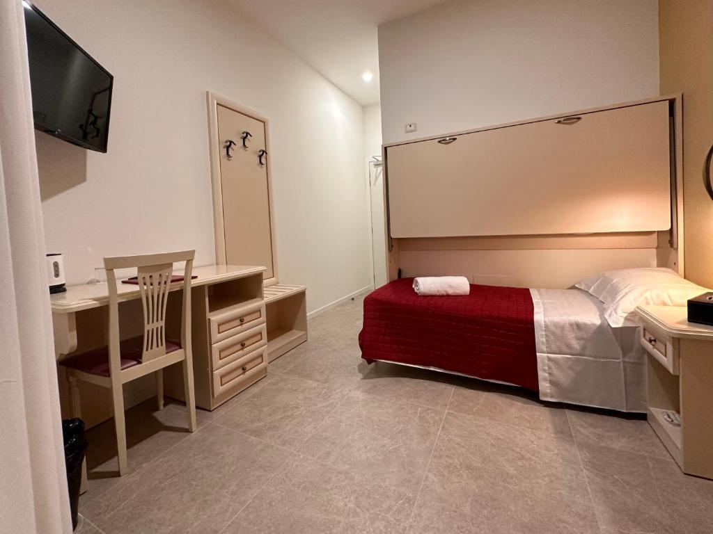 Postel nebo postele na pokoji v ubytování Collegio AMDG