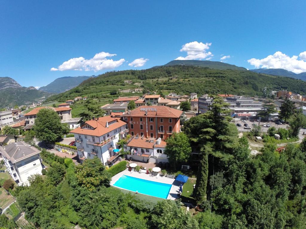 a villa with a swimming pool in a village at Hotel Sant'Ilario in Rovereto