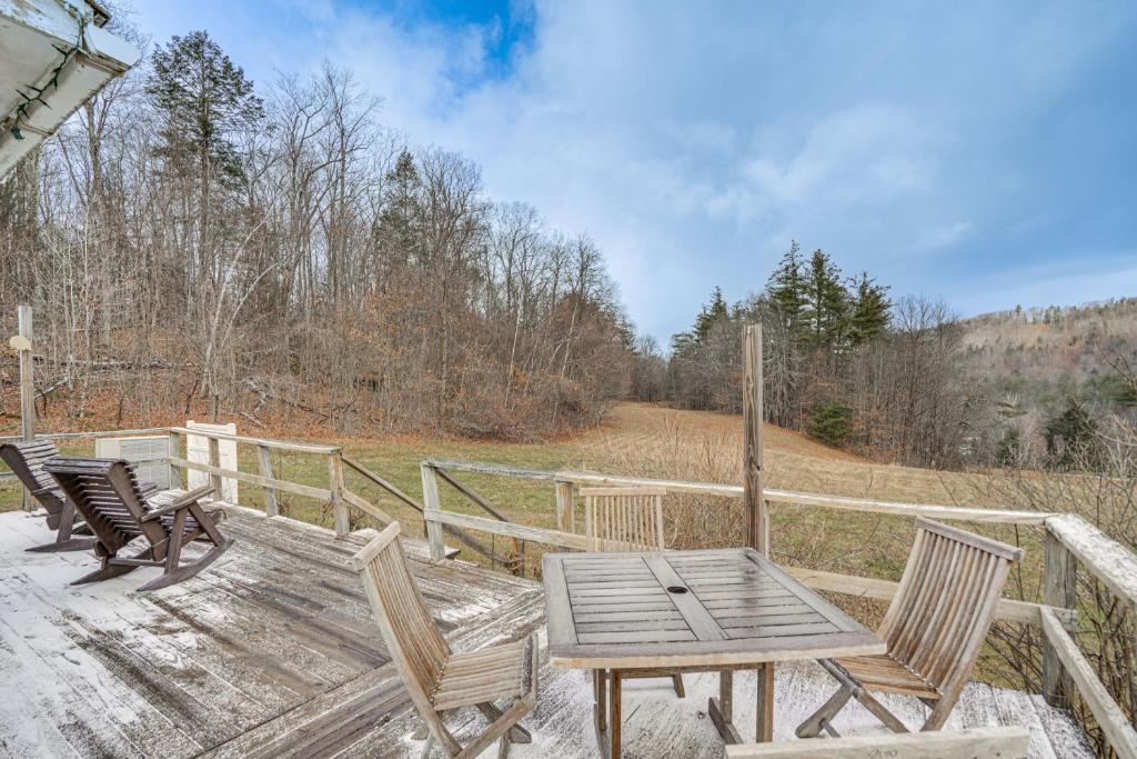 a wooden table and chairs sitting on a deck at Hawley Home with Deck 4 Mi to Berkshire East Resort in Hawley
